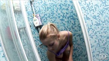 The situation is stripped to the essentials mandy is in a shower stall in a cute little lavender top, colorfully striped booty shorts.